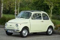 Old green Fiat 500 parked in the street Royalty Free Stock Photo