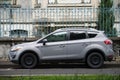 Profile view of grey Ford Kuga suv car parked in the street