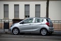 Profile view of grey Opel COrsa parked in the street