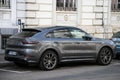 Profile view of grey Porsche cayenne hybrid parked in the street