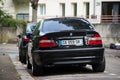 Rear view of black BMW 330d parked in the street