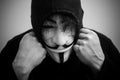 Womman wearing Vendetta mask. This mask is a well-known symbol for the online hacktivist group Anonymous