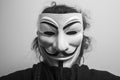 Womman wearing Vendetta mask. This mask is a well-known symbol for the online hacktivist group Anonymous Royalty Free Stock Photo