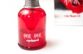 Amor Amor perfume from cacharel brand in red bottle on white background
