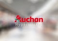 Auchan supermarket logo on the window of the store entry