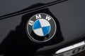 closeup of bmw logo on black car parked in the street Royalty Free Stock Photo