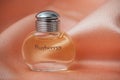 Burberry from london perfume in a transparent bottle on satin background