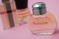 Burberry from London perfume in a transparent bottles on pink background