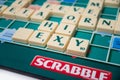 Plastic letters to forming crosswords on Scrabble board game Royalty Free Stock Photo