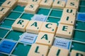 Plastic letters to forming  crosswords on Scrabble board game Royalty Free Stock Photo