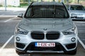 Front view of grey BMW X5 parked in the street Royalty Free Stock Photo