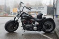 Profie view of black Harley Davidson motorbike parked in the street Royalty Free Stock Photo