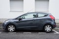 Profile view of grey Ford Fiesta parked in the street