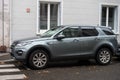 Profile view of grey range rover suv car parked in the street