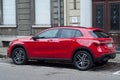 Rear view of red Mercedes GLA 180 diesel parked in the street
