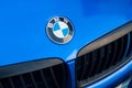 BMW logo on blue car front parked in the street Royalty Free Stock Photo