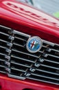 Logo on red vintage alfa romeo front car parked in the street Royalty Free Stock Photo