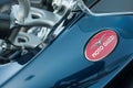 Logo on vintage blue moto Guzzi tank of motorbike parked in the street Royalty Free Stock Photo