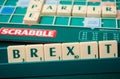 Plastic letters on Scrabble board game forming the word : Brexit