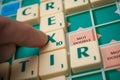 Plastic letters on Scrabble board game forming the word : Brexit