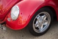 Closeup of red Volkswagen beetle car parked in the street Royalty Free Stock Photo