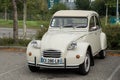 Front view of beige Citroen 2CV parked in the street