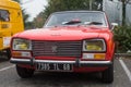 Front view of orange Peugeot 304 vintage car parked in the street Royalty Free Stock Photo