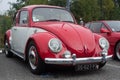 Front view of red Volkswagen beetle car parked in the street Royalty Free Stock Photo