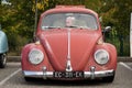 Front view of vintahe Volkswagen beetle parked in the street