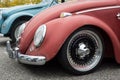 Front view of vintahe Volkswagen beetle parked in the street