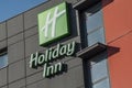 Holiday inn hotel logo on modern building. Holliday Inn is an americain chain company of hostelry