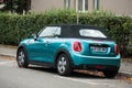 Blue mini cooper convertible parked in the street Royalty Free Stock Photo