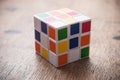 Rubik`s cube on wooden table background Royalty Free Stock Photo