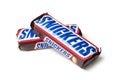 Two Snikers chocolate bar on white background