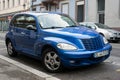 Front view of blue Chrysler Cruiser parked in the street Royalty Free Stock Photo