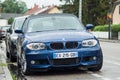 Front view of blue convertible BMW parked in the street Royalty Free Stock Photo