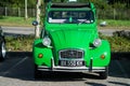 Front view of green citroen 2CV parked in the street