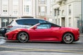 Profile view of red ferrari F430 convertible parked in the street