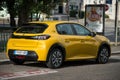 Rear view of Yellow Peugeot 208 electric parked in the street Royalty Free Stock Photo