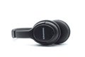 Closeup of black wireless headphones by Grundig on white background Royalty Free Stock Photo