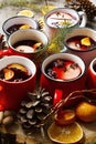 Mulled hot wine or gluhwein in cups of different shapes Royalty Free Stock Photo