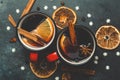 Mulled wine background. A hot winter Christmas drink based on red wine, spices and citrus fruits Royalty Free Stock Photo