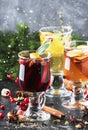 Mulled wine and mulled cider. Hot winter drinks and cocktails for christmas or new year`s eve in glass mugs with spices and citru Royalty Free Stock Photo