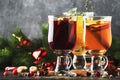 Mulled wine and mulled cider. Hot winter drinks and cocktails for christmas or new year`s eve in glass mugs with spices and citru Royalty Free Stock Photo