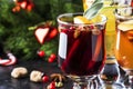 Mulled wine and mulled cider. Hot winter drinks and cocktails for christmas or new year`s eve in glass mugs with spices and citru Royalty Free Stock Photo