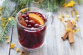 Mulled wine with cinnamon and orange, cranberries