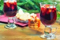 Mulled wine with cinnamon sticks and christmas bell-formed cookies Royalty Free Stock Photo