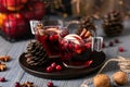 Mulled wine in glasses on a wooden background. Apples, cranberries, cinnamon, star anise. Royalty Free Stock Photo