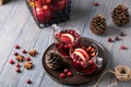 Mulled wine in glasses on a wooden background. Apples, cranberries, cinnamon, star anise. Royalty Free Stock Photo