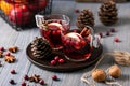 Mulled wine in glasses on a wooden background. Apples, cranberries, cinnamon, star anise Royalty Free Stock Photo